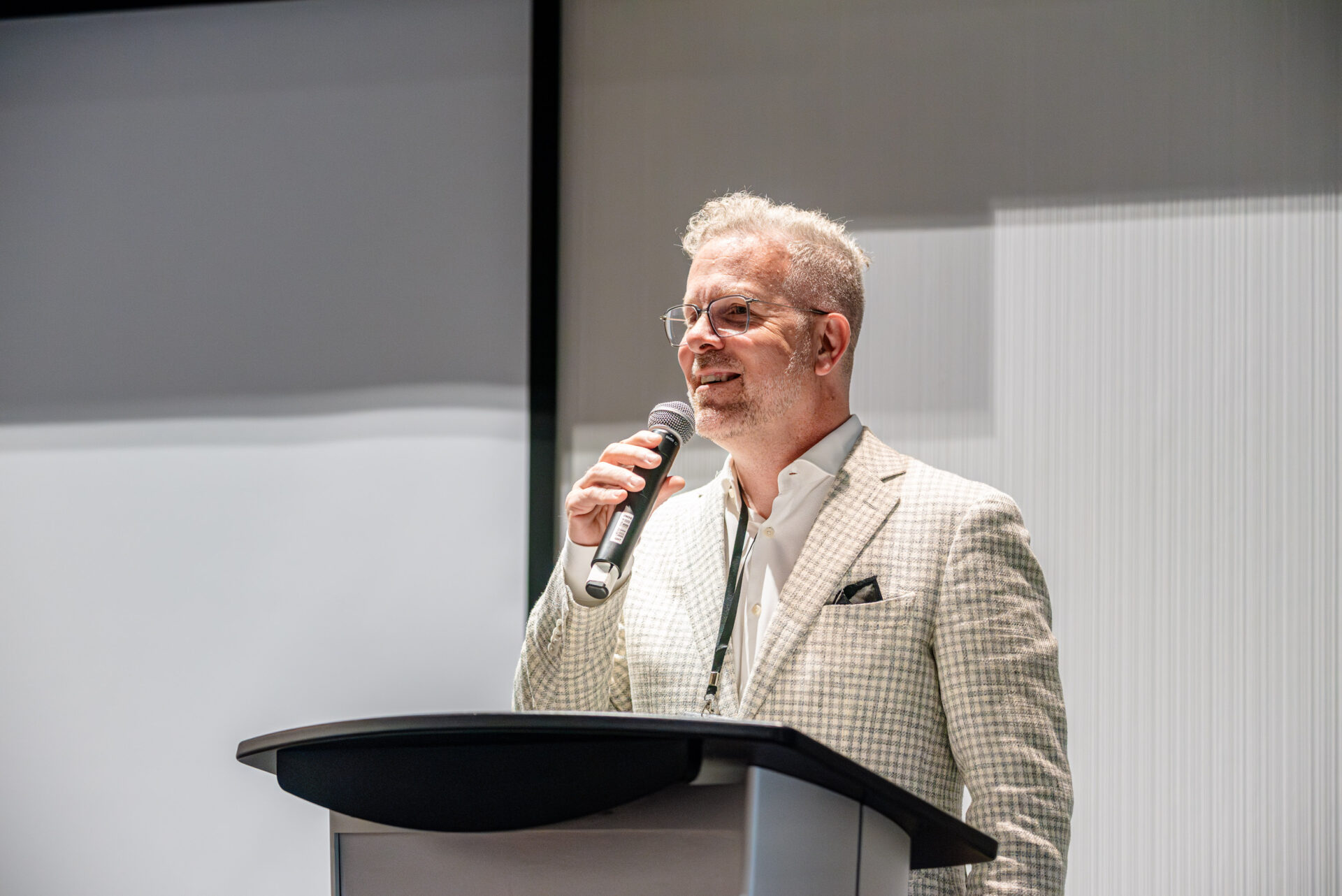 Christian Quenneville, president and partner at m&h, speaking on stage at the C-Suite Marketing Summit.