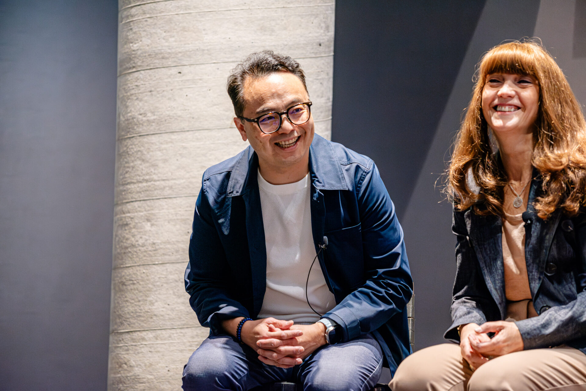 David Lui and Anna Martini during a panel discussion at the C-Suite Marketing Summit.