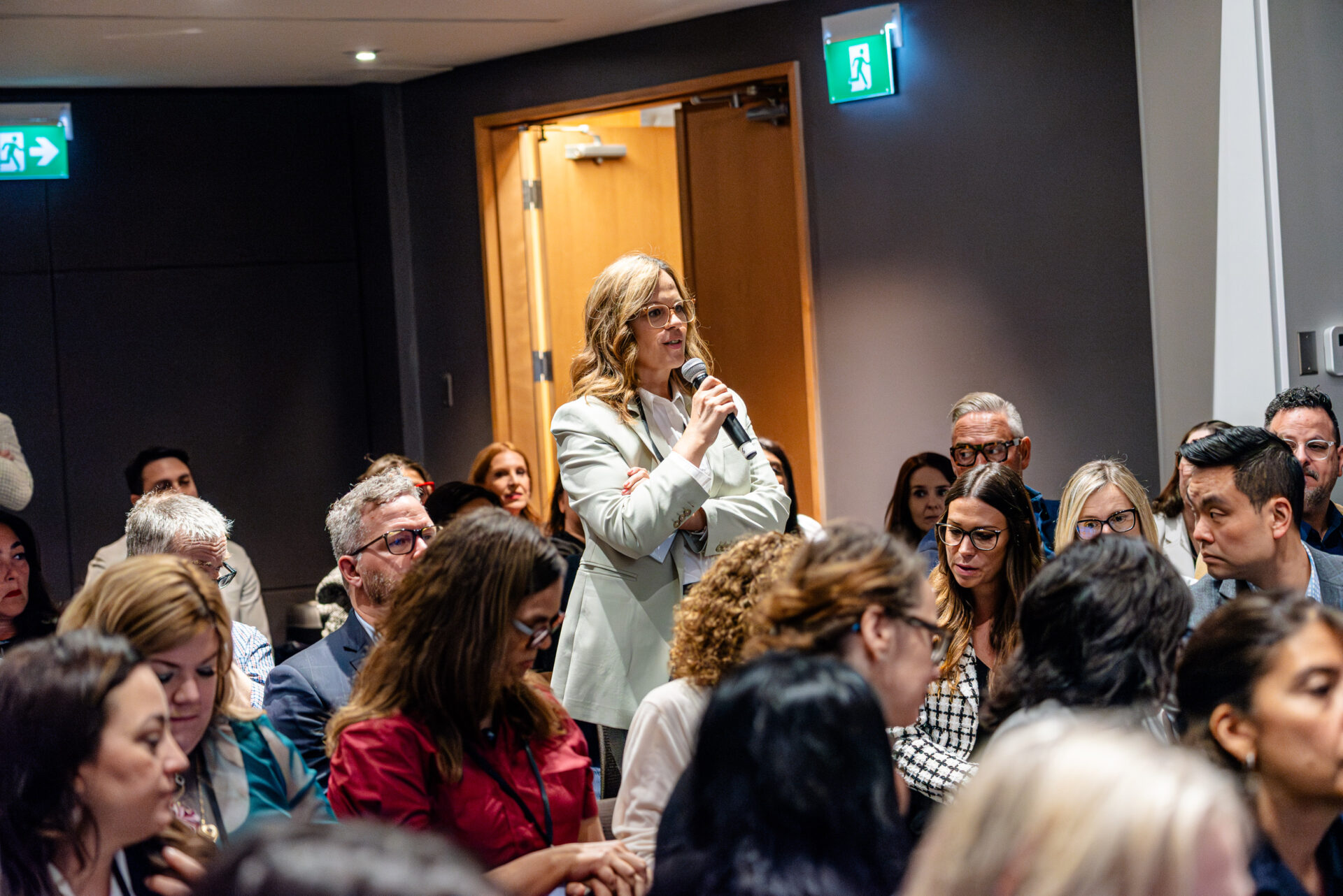 Attendee asking a question at the C-Suite Marketing Summit.