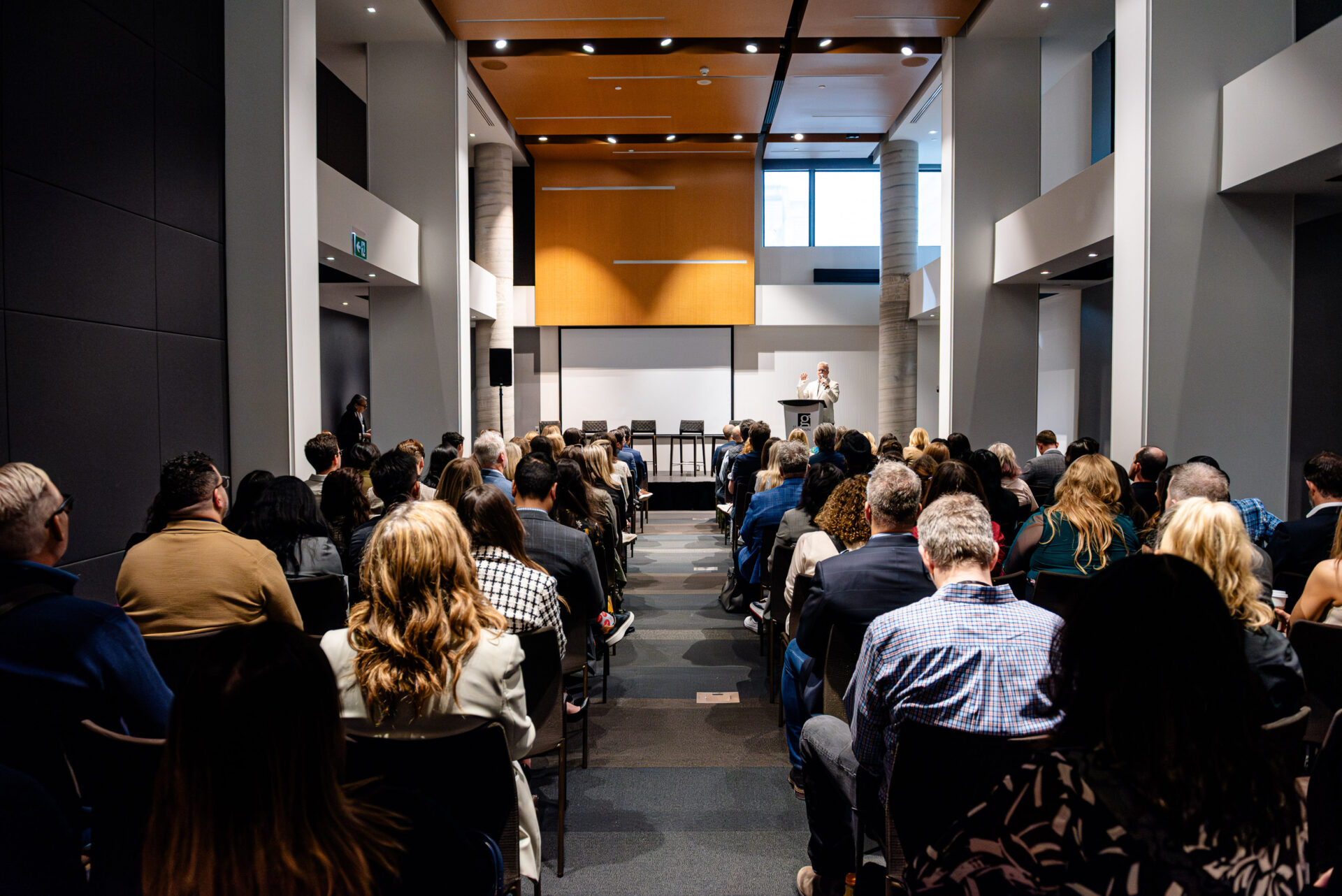 Christian Quenneville, president and partner at m&h, addressing a full audience at the C-Suite Marketing Summit conference.